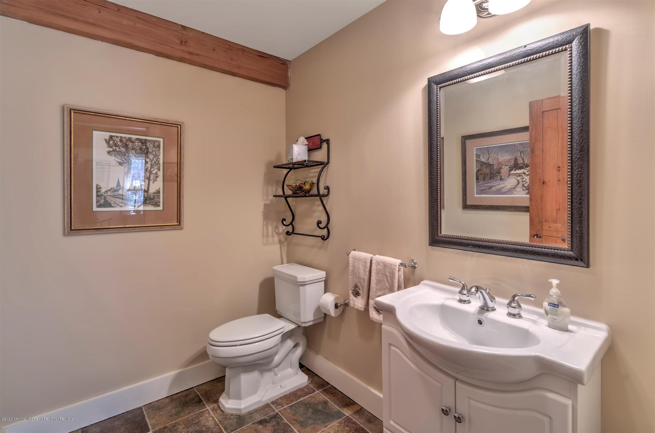 886 Province Line Road Allentown, NJ 08501 - Photo 22 of 56 a bathroom with a toilet a sink and mirror