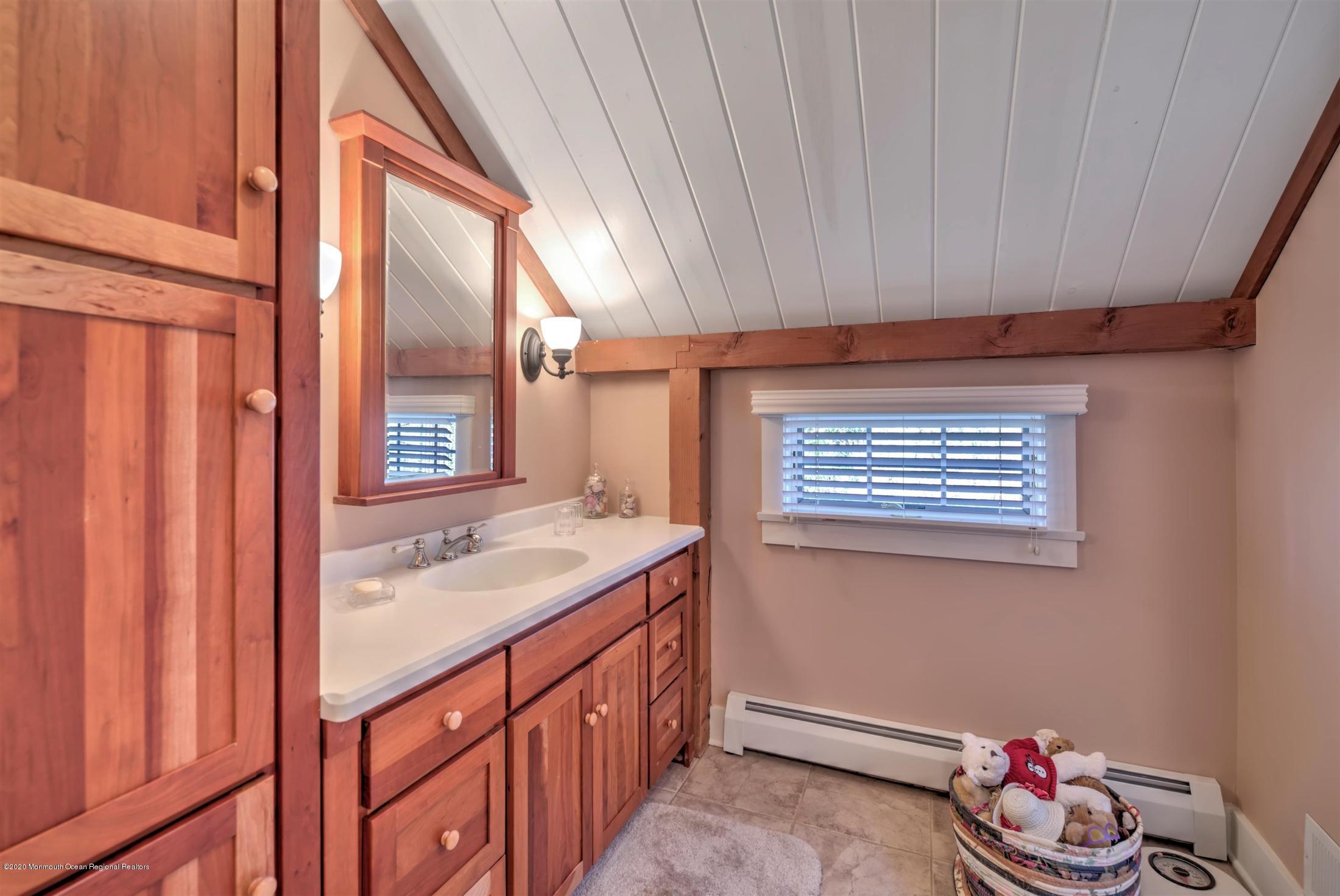 886 Province Line Road Allentown, NJ 08501 - Photo 30 of 56 a bathroom with a sink and a mirror