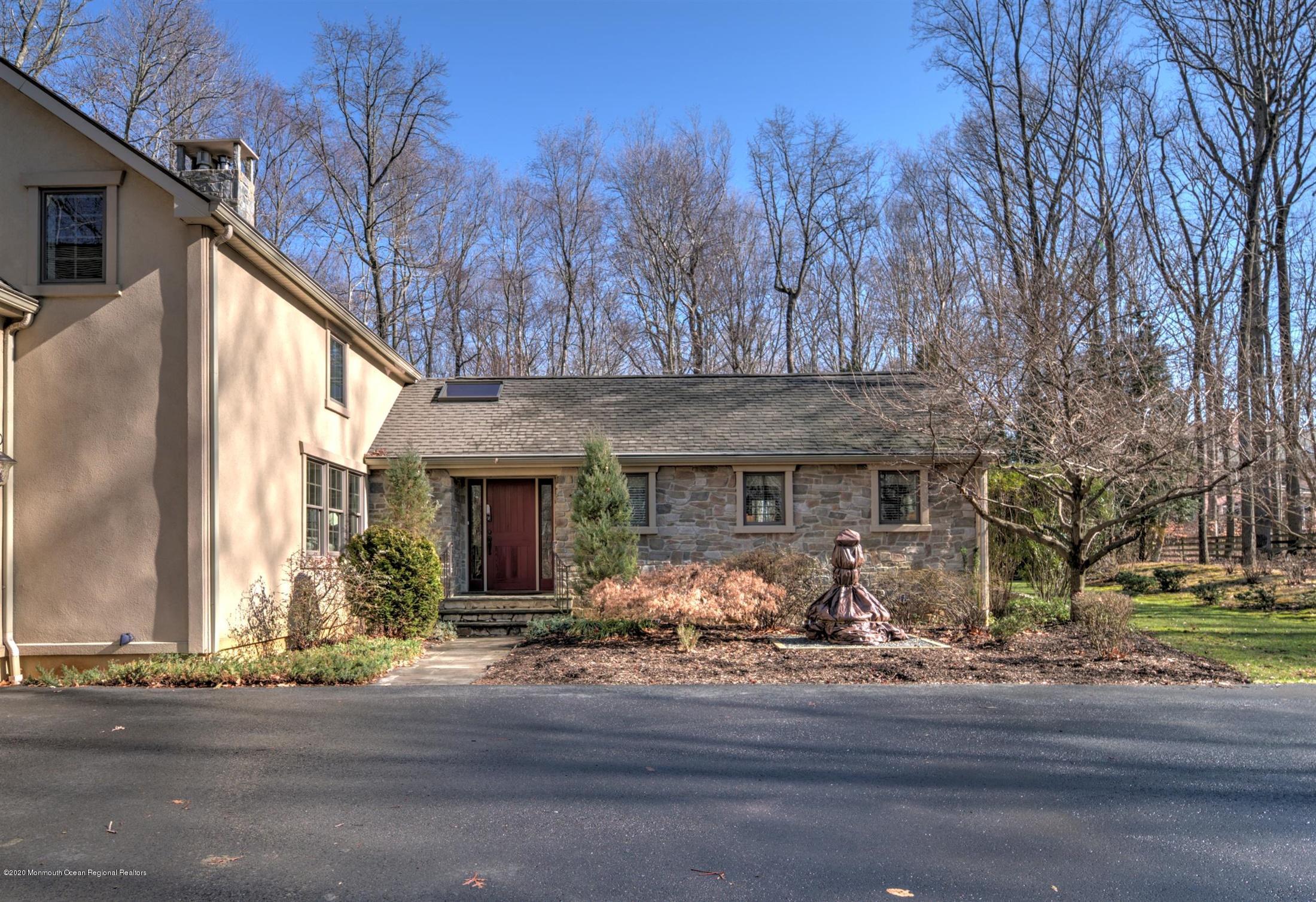 886 Province Line Road Allentown, NJ 08501 - Photo 42 of 56 a front view of a house with lots of trees