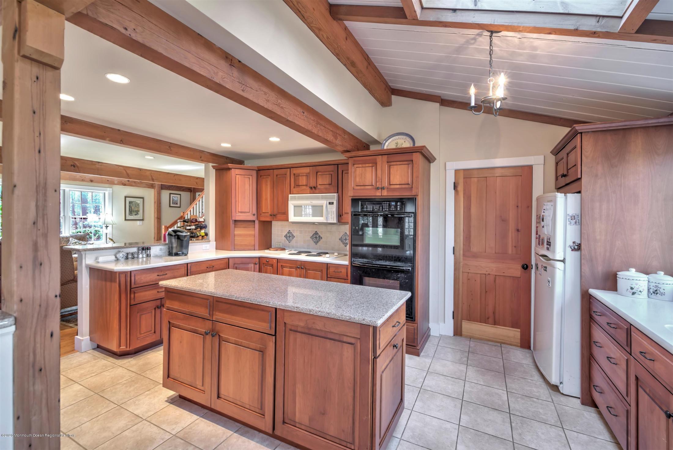 886 Province Line Road Allentown, NJ 08501 - Photo 7 of 56 a kitchen with stainless steel appliances granite countertop a sink and cabinets