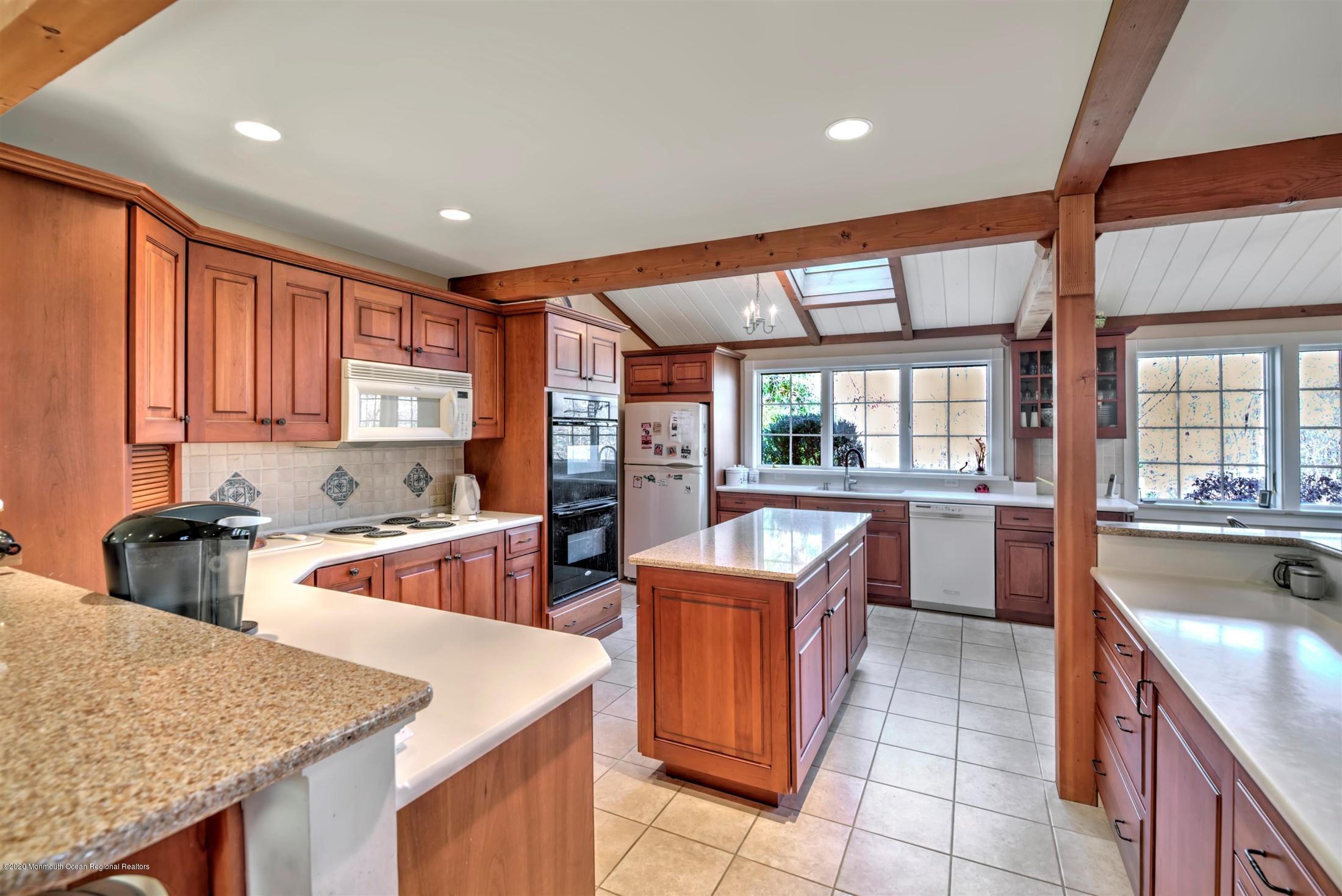886 Province Line Road Allentown, NJ 08501 - Photo 8 of 56 a kitchen with stainless steel appliances granite countertop sink stove and refrigerator