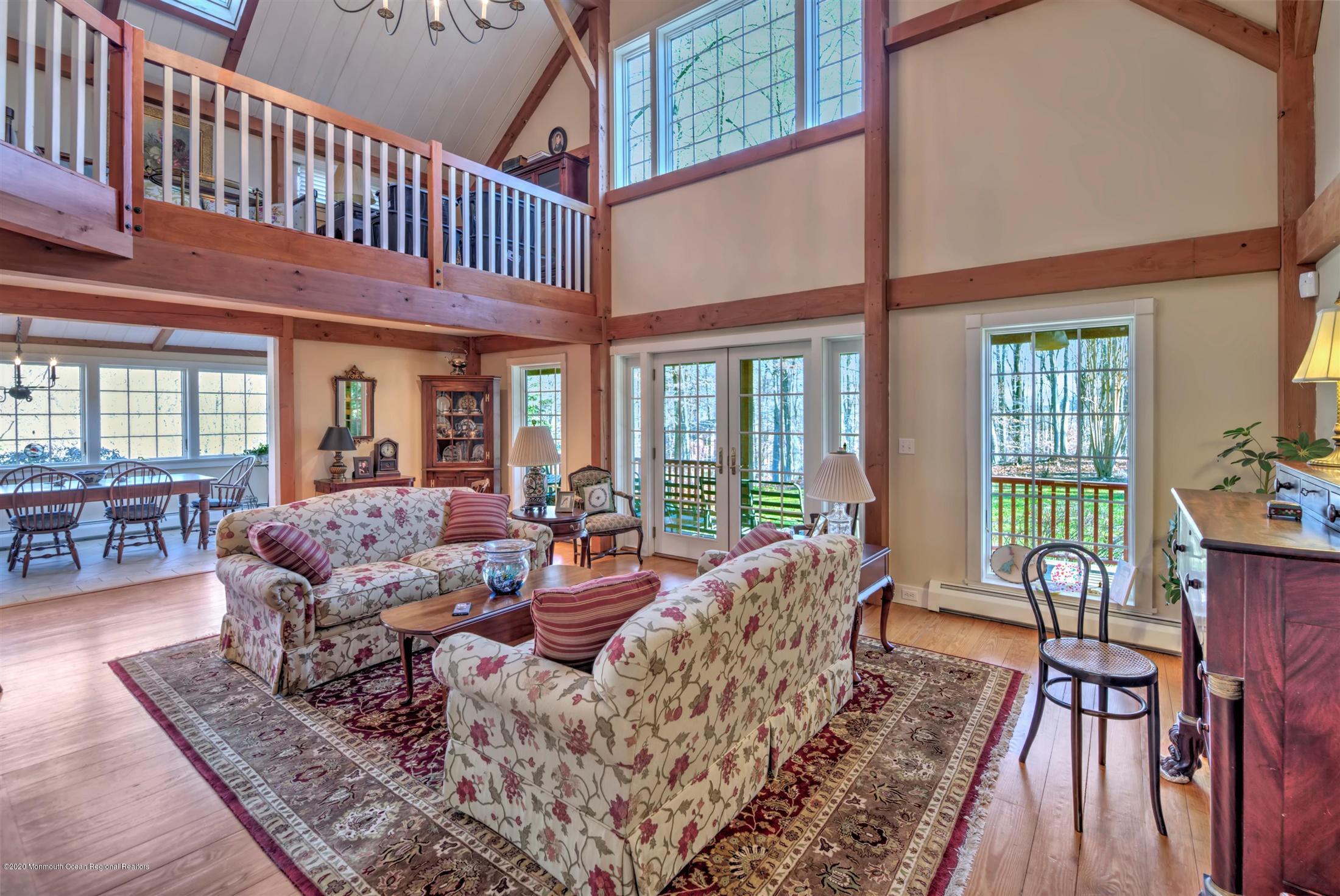 886 Province Line Road Allentown, NJ 08501 - Photo 9 of 56 a living room with furniture floor to ceiling window and wooden floor