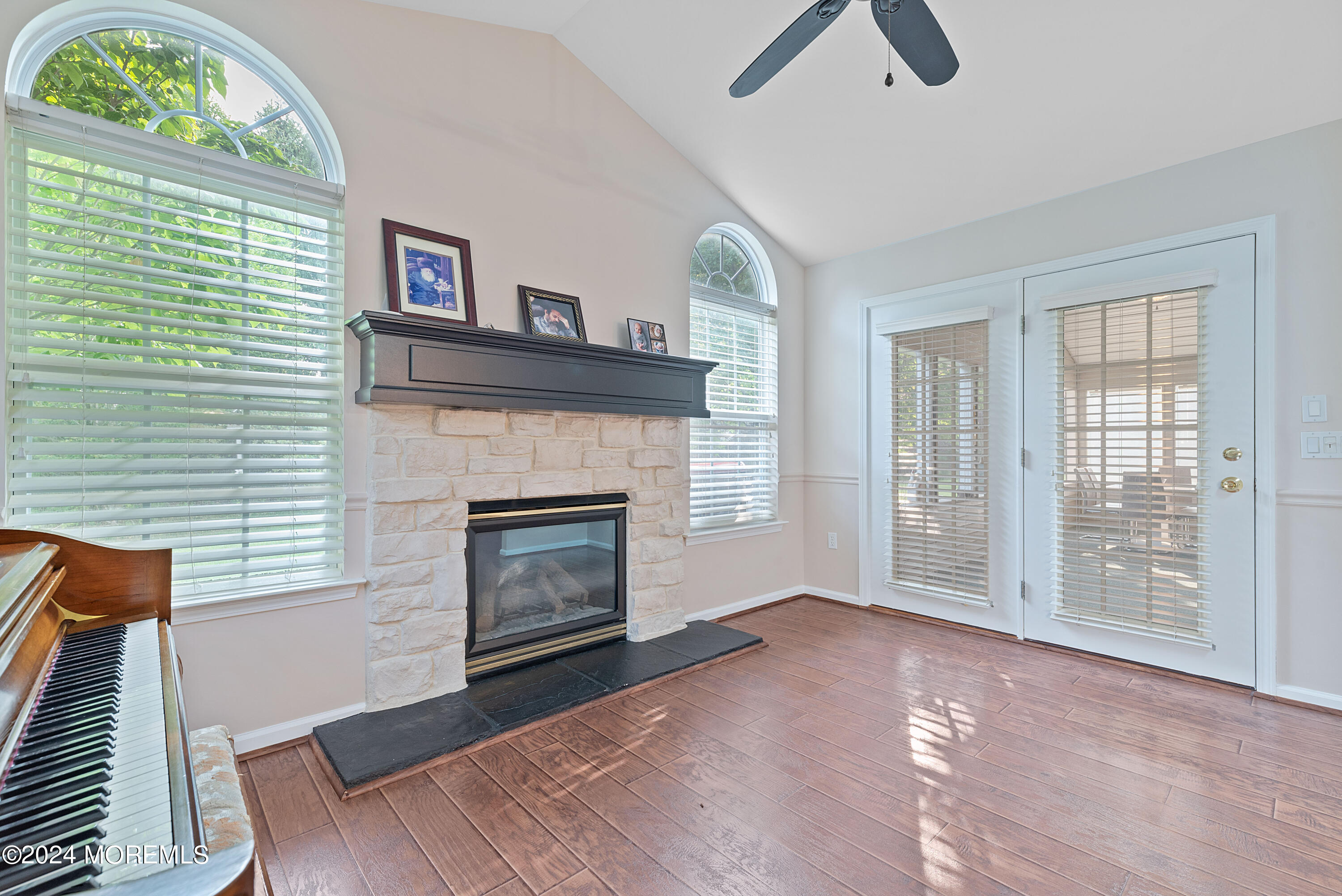 54 Foxwood Road Lakewood, NJ 08701 - Photo 11 of 45 a view of an empty room with a fireplace and a window