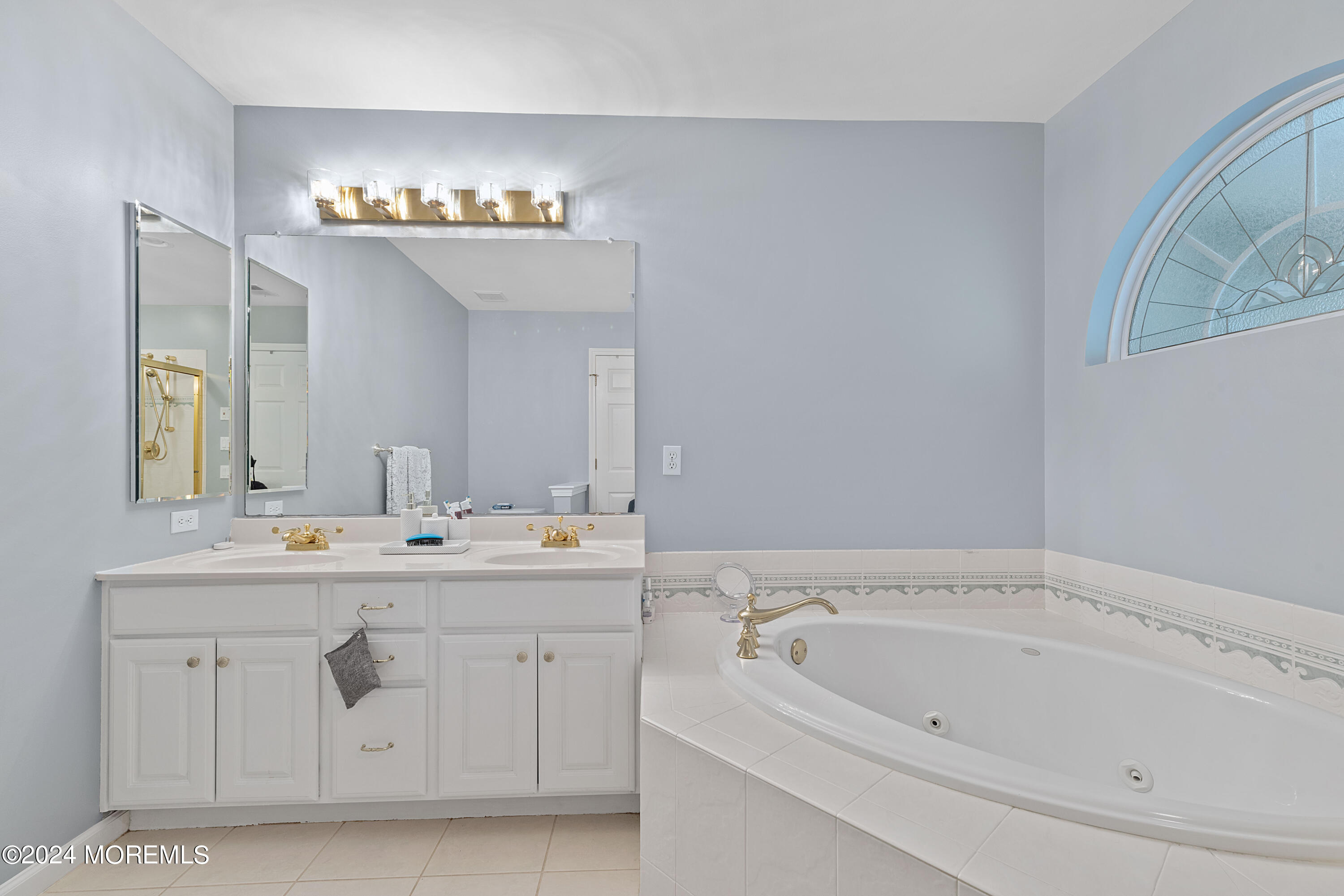 54 Foxwood Road Lakewood, NJ 08701 - Photo 21 of 45 a spacious bathroom with a sink and a mirror