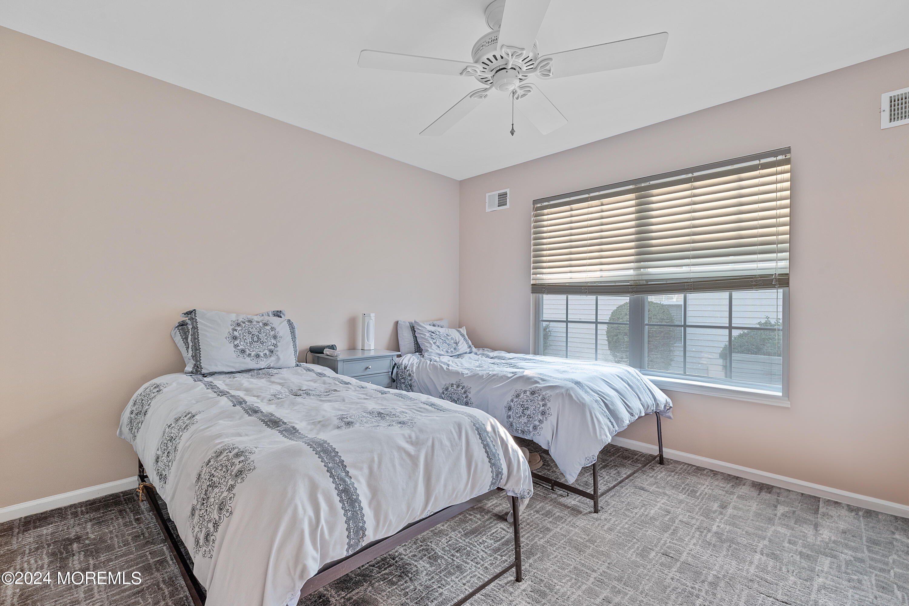 54 Foxwood Road Lakewood, NJ 08701 - Photo 22 of 45 a bedroom with two beds and a window