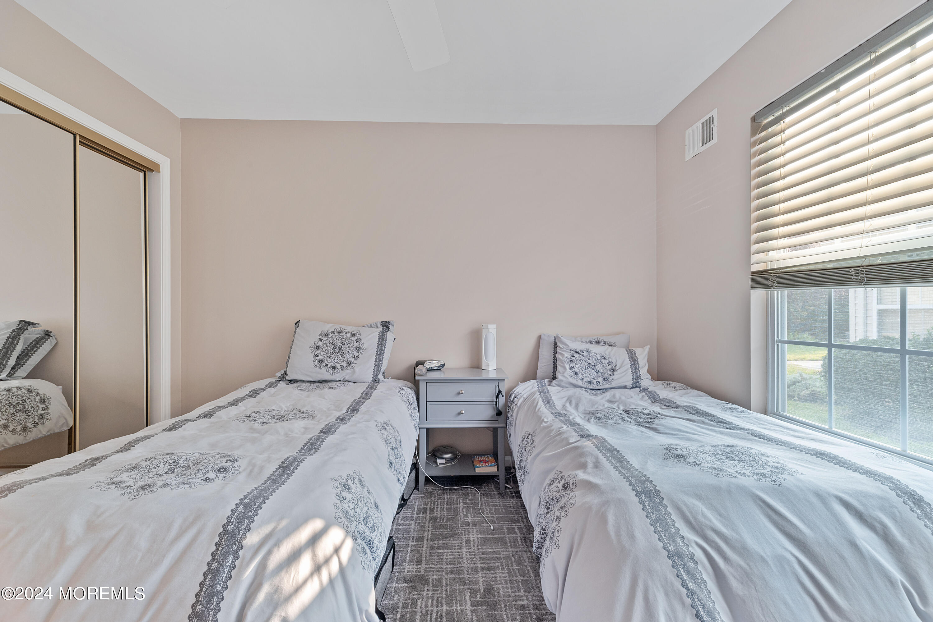 54 Foxwood Road Lakewood, NJ 08701 - Photo 23 of 45 a bedroom with two beds and a large window