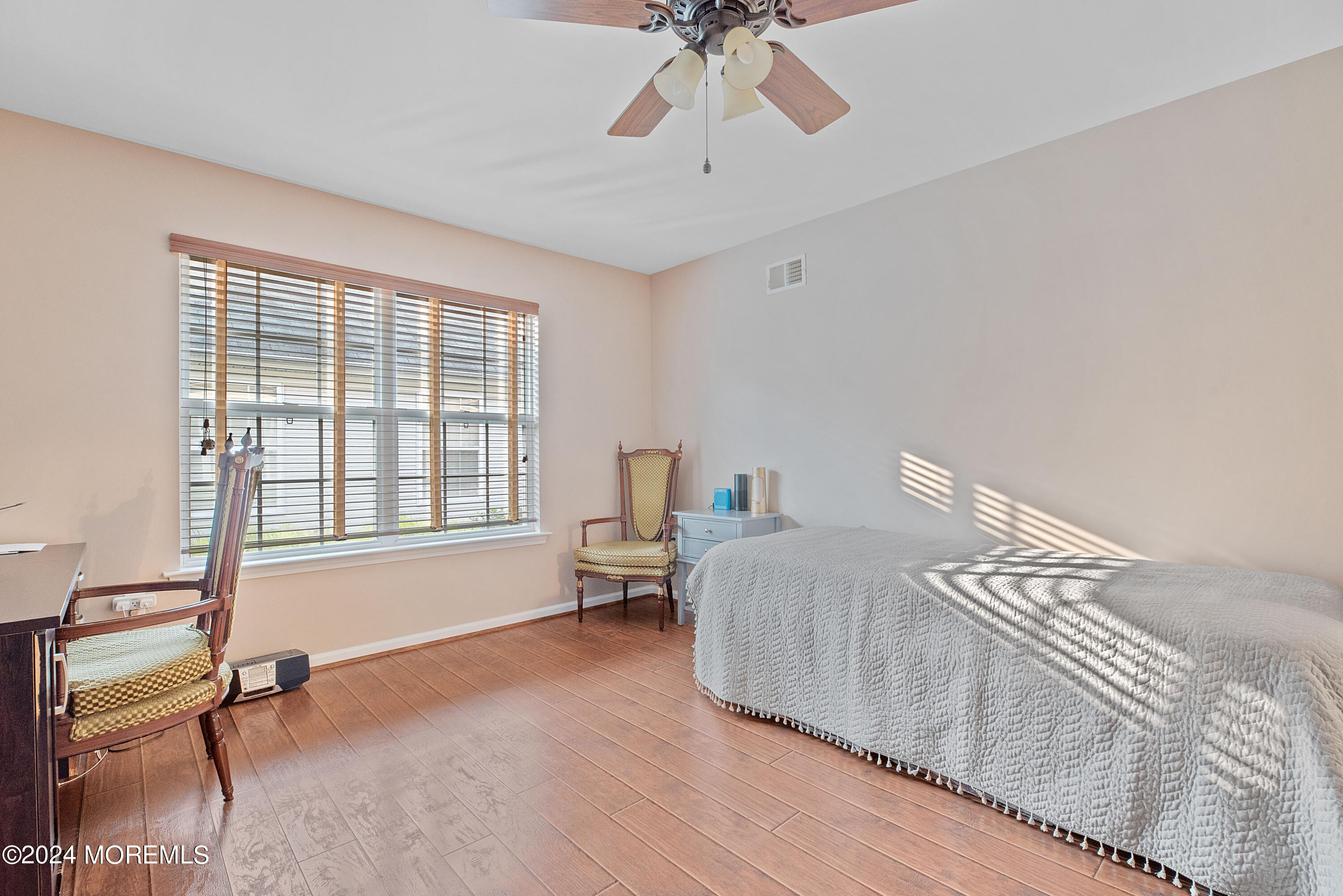54 Foxwood Road Lakewood, NJ 08701 - Photo 25 of 45 a spacious bedroom with a bed and a window