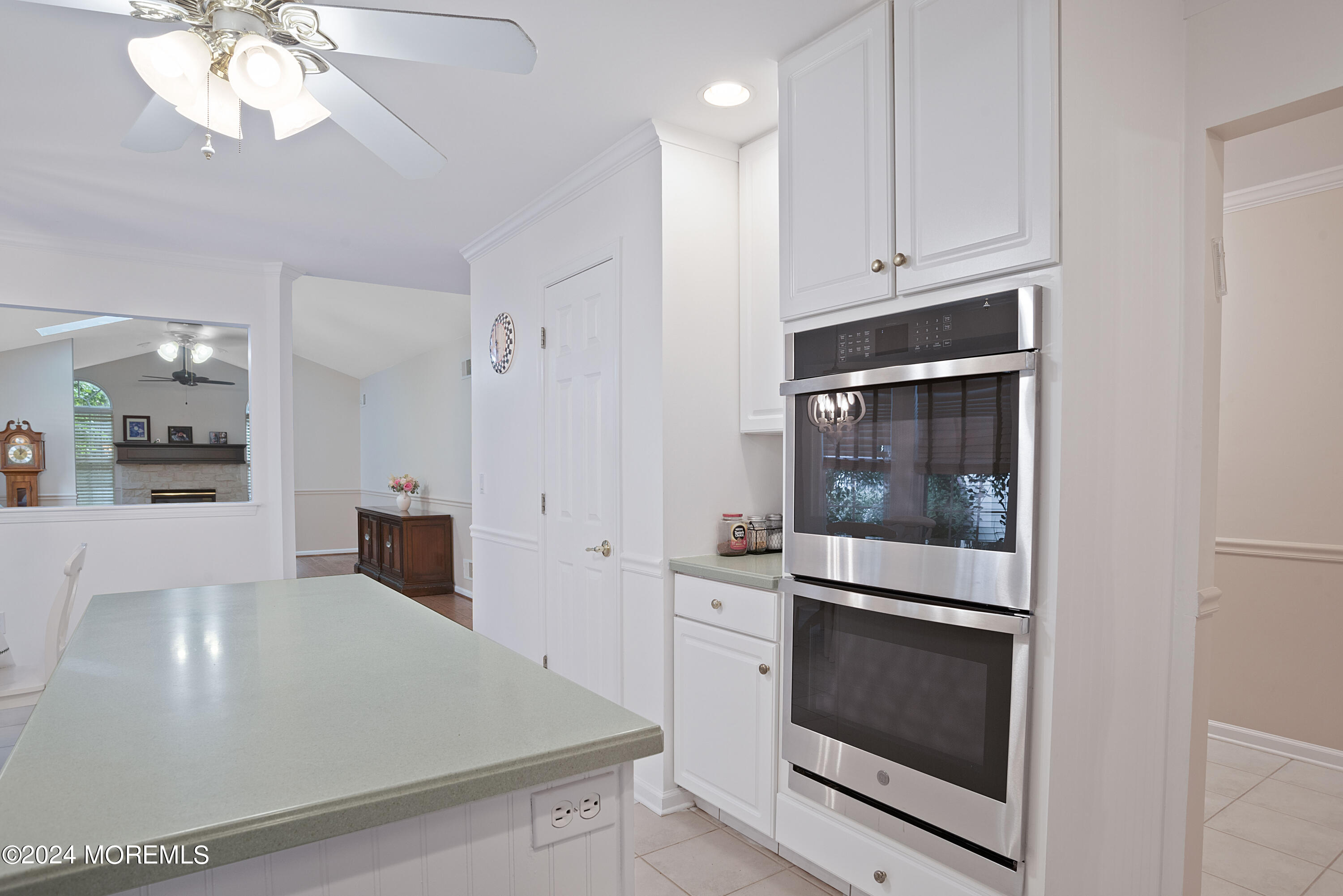 54 Foxwood Road Lakewood, NJ 08701 - Photo 29 of 45 a kitchen with stainless steel appliances a white stove top oven and white cabinets
