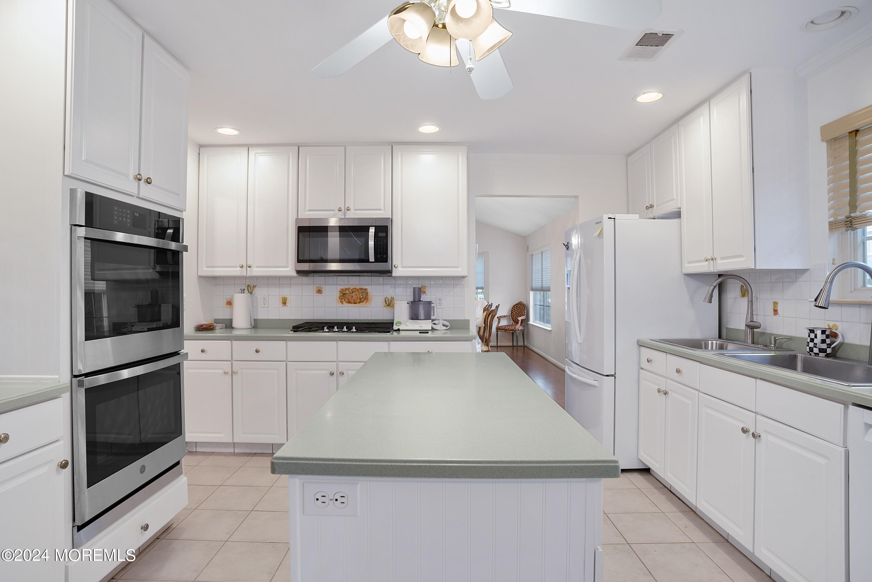 54 Foxwood Road Lakewood, NJ 08701 - Photo 30 of 45 a kitchen with granite countertop a refrigerator stove and microwave