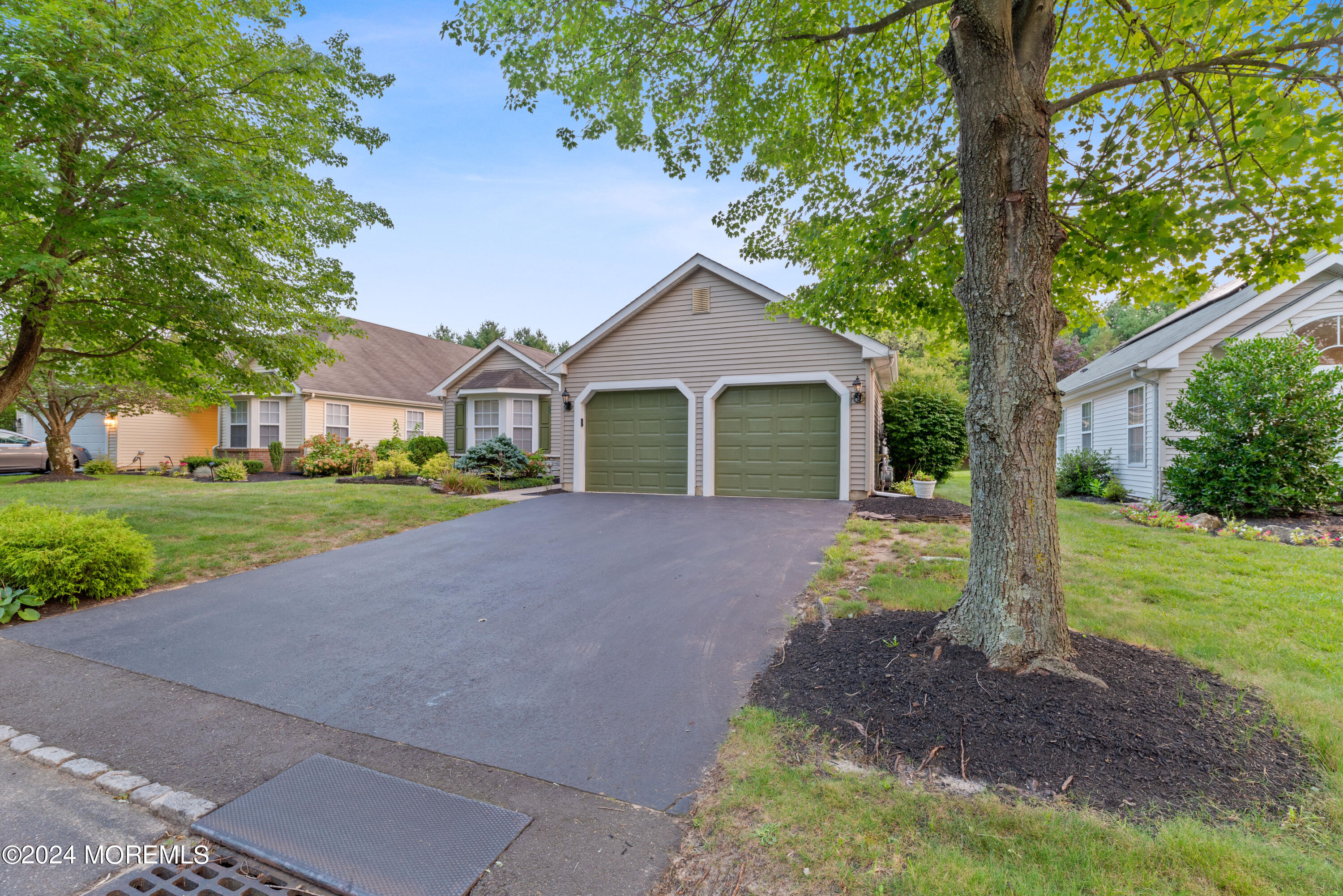 54 Foxwood Road Lakewood, NJ 08701 - Photo 34 of 45 a front view of a house with garden