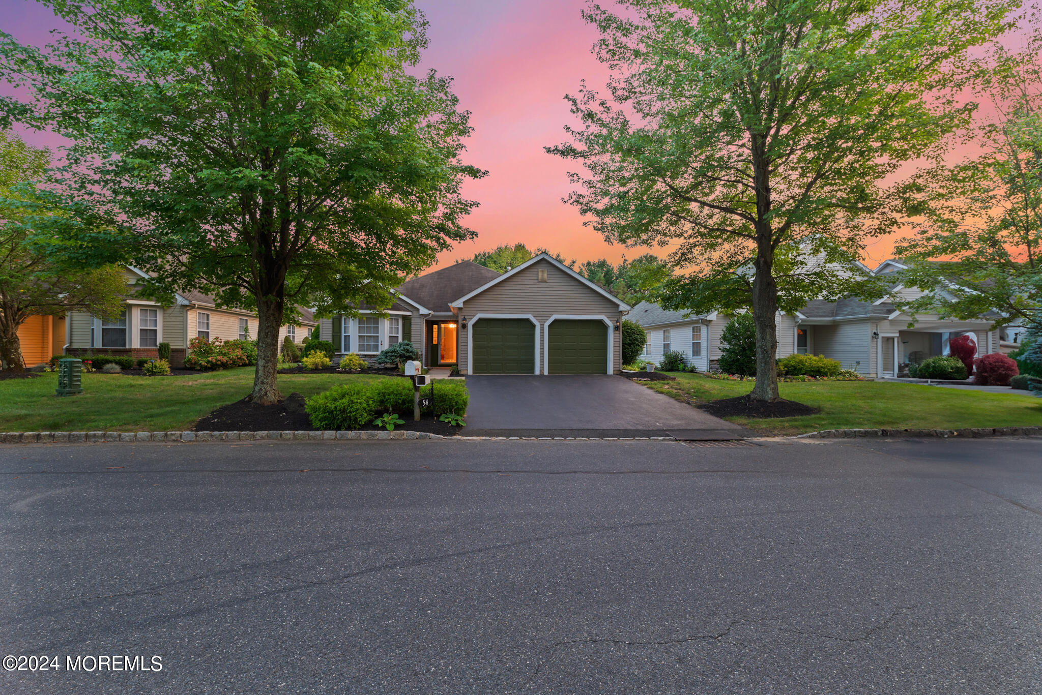54 Foxwood Road Lakewood, NJ 08701 - Photo 35 of 45 a front view of a house with a yard and garage
