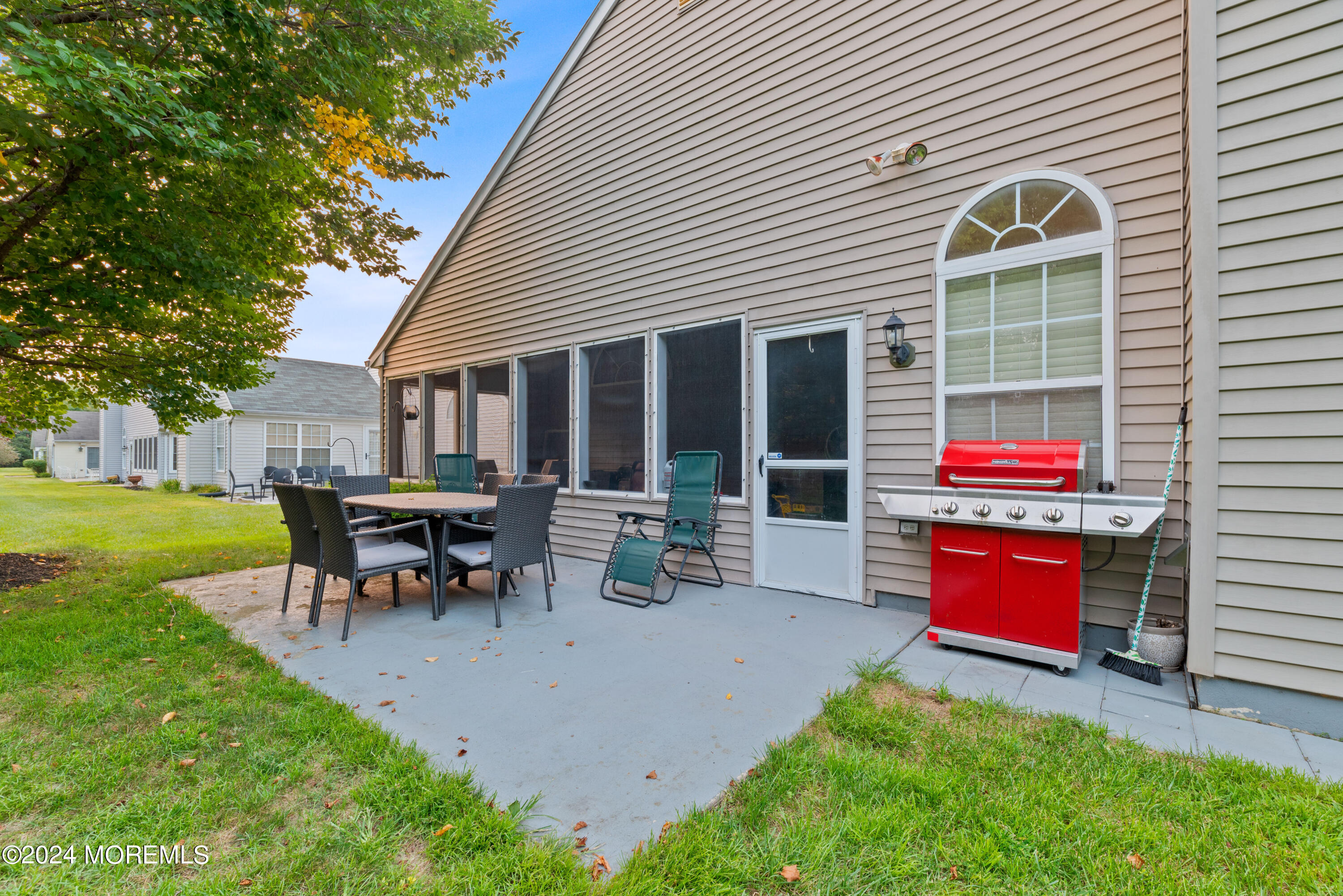 54 Foxwood Road Lakewood, NJ 08701 - Photo 38 of 45 a view of a house with a yard and sitting area