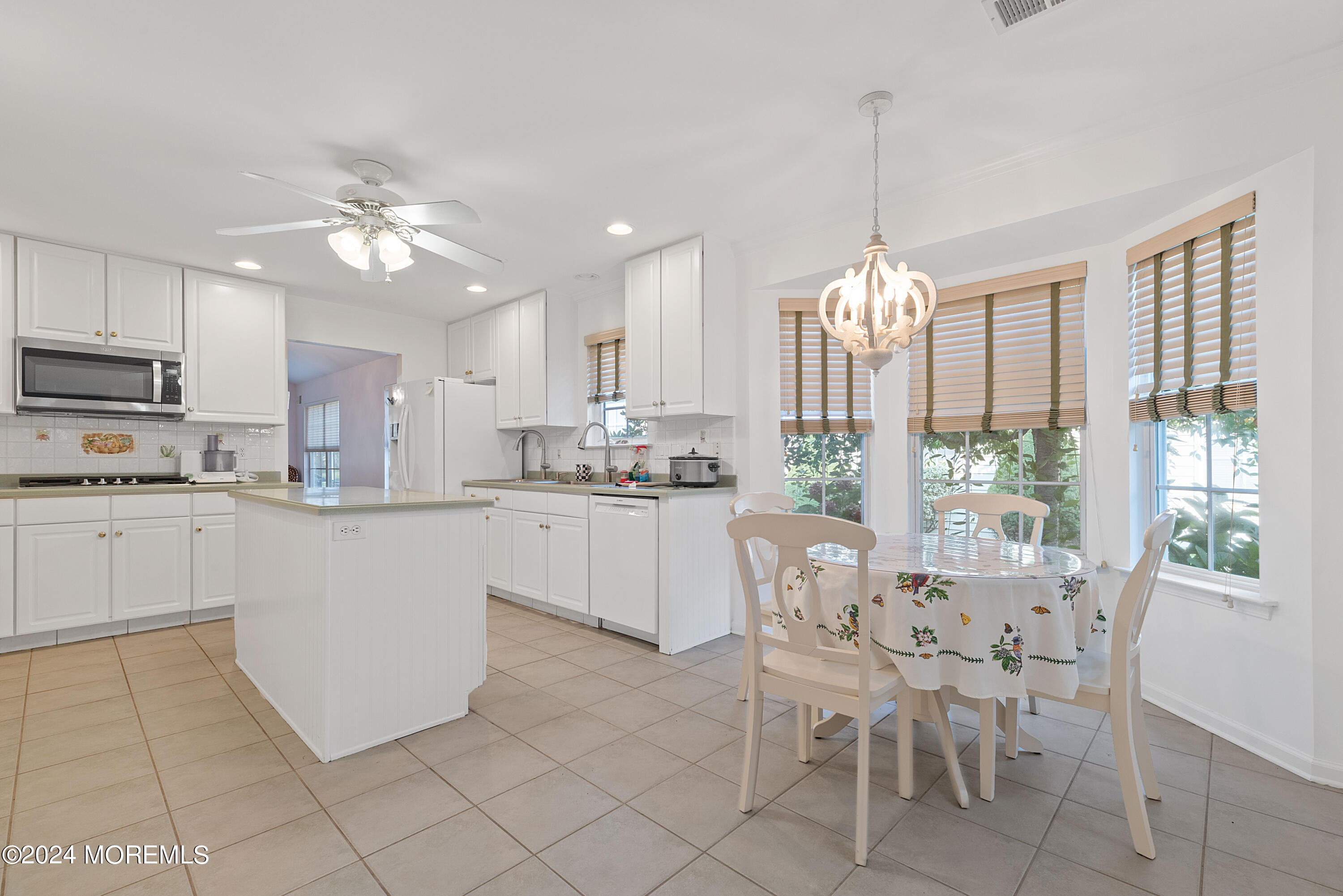 54 Foxwood Road Lakewood, NJ 08701 - Photo 4 of 45 a kitchen with cabinets and chairs