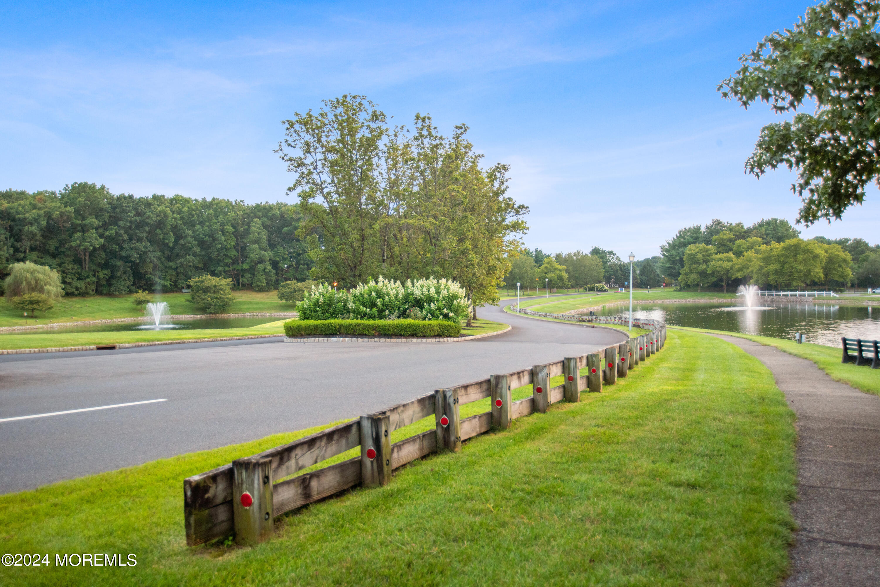 54 Foxwood Road Lakewood, NJ 08701 - Photo 42 of 45 a view of an outdoor space and a lake view