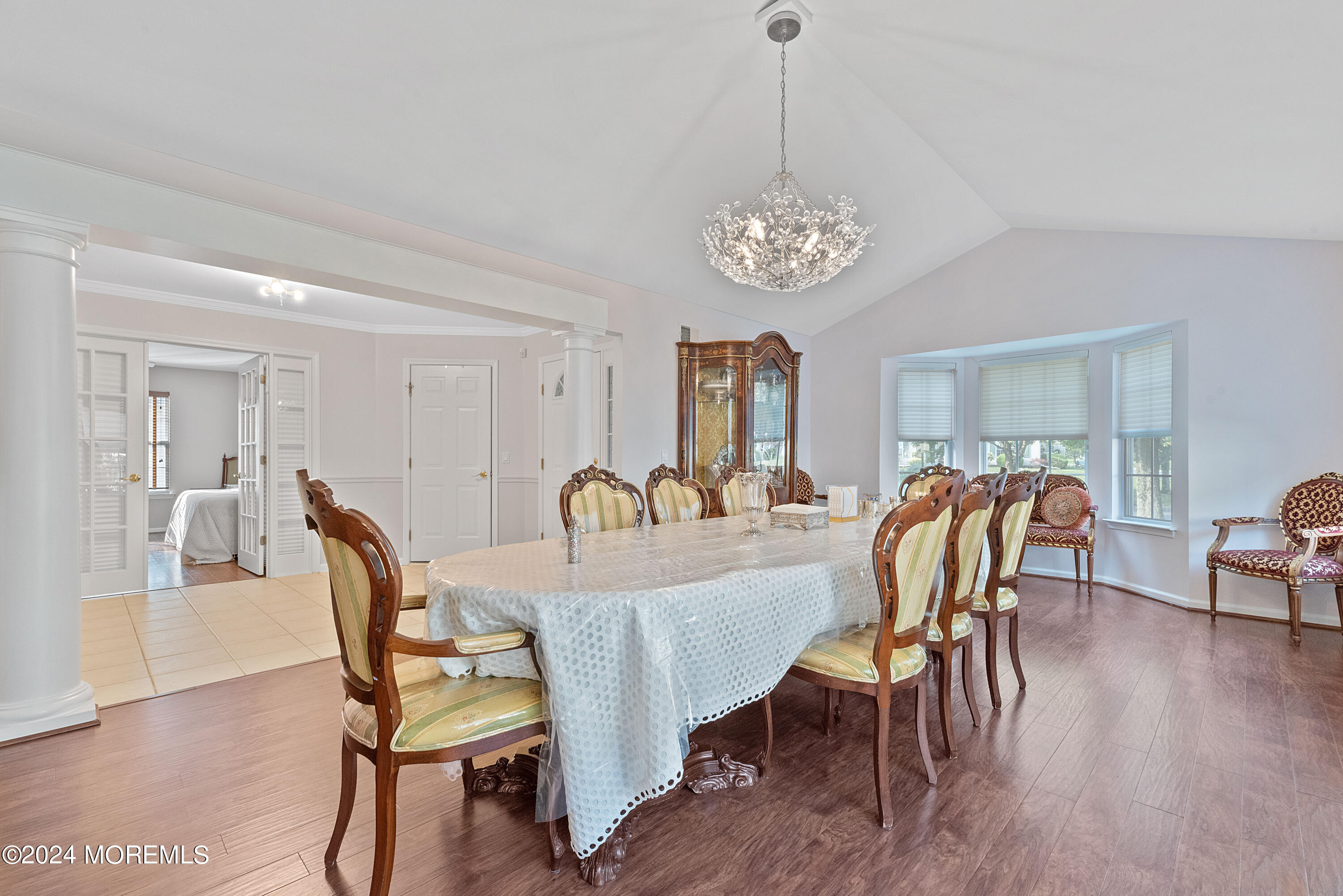 54 Foxwood Road Lakewood, NJ 08701 - Photo 6 of 45 a view of a dining room with furniture wooden floor and chandelier