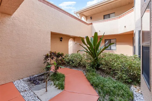 a bathroom with a shower and closet