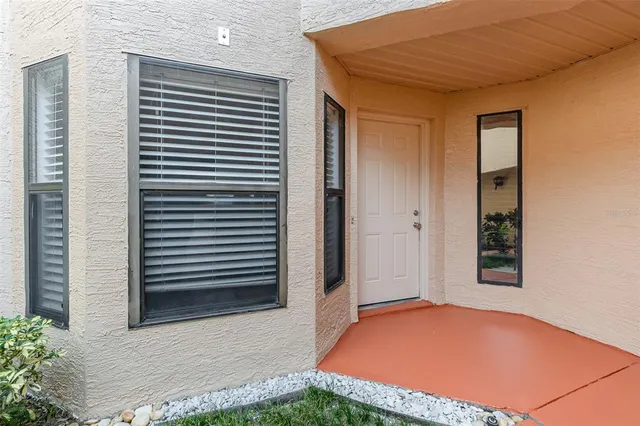 a view of wooden floor and a chandelier in a room