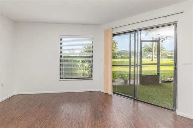 a kitchen with granite countertop a stove microwave and sink
