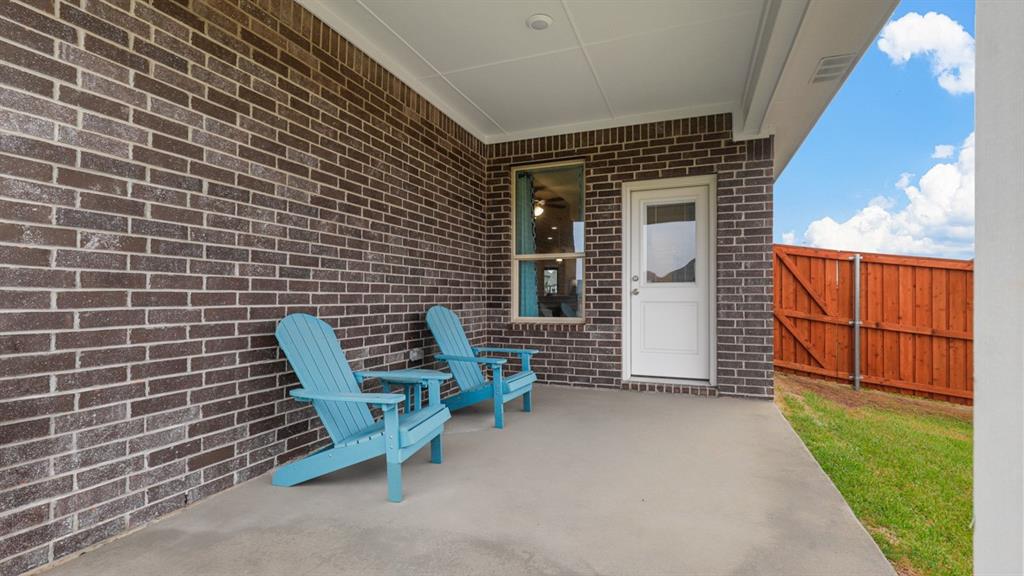 129 Hugo Court Rhome, TX 76078 - Photo 28 of 34 a view of a chairs with a door