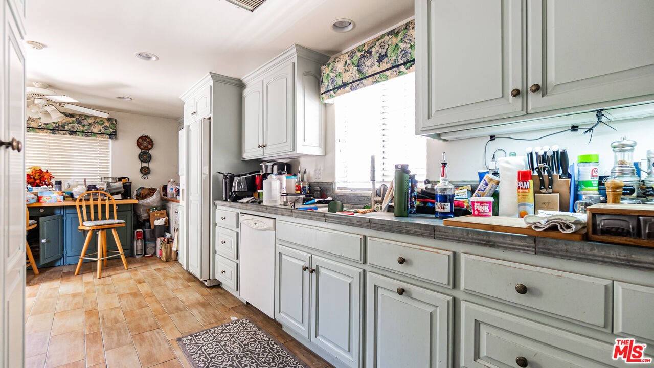 25843 Browning Place Stevenson Ranch, CA 91381 - Photo 14 of 37 a kitchen with lots of counter top space and furniture