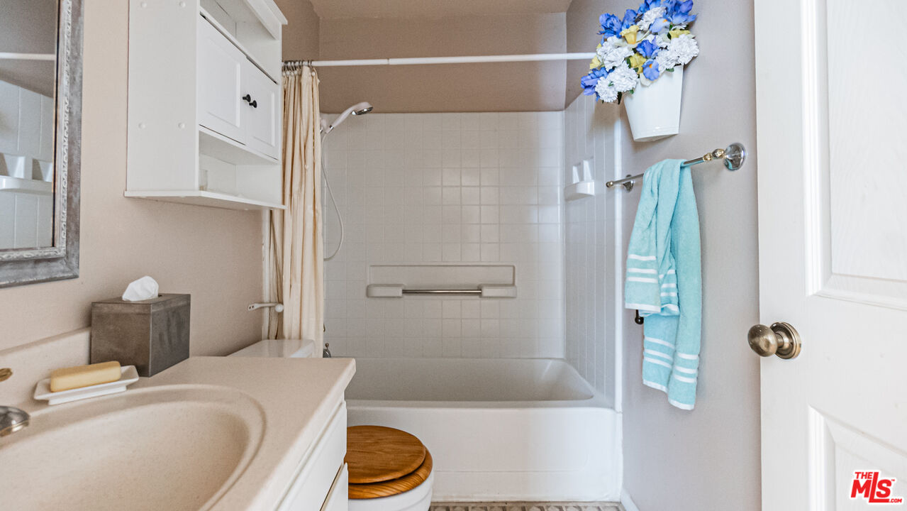 25843 Browning Place Stevenson Ranch, CA 91381 - Photo 18 of 37 a bathroom with a sink a toilet and shower
