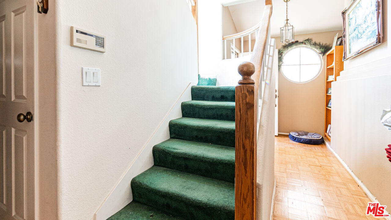 25843 Browning Place Stevenson Ranch, CA 91381 - Photo 20 of 37 a view of entryway and hall with wooden floor