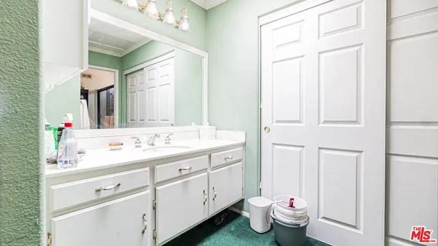 a bathroom with a toilet and a sink