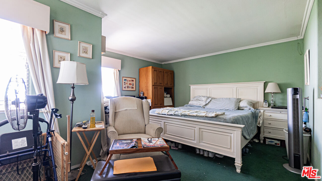 25843 Browning Place Stevenson Ranch, CA 91381 - Photo 26 of 37 a bedroom with furniture and a lamp