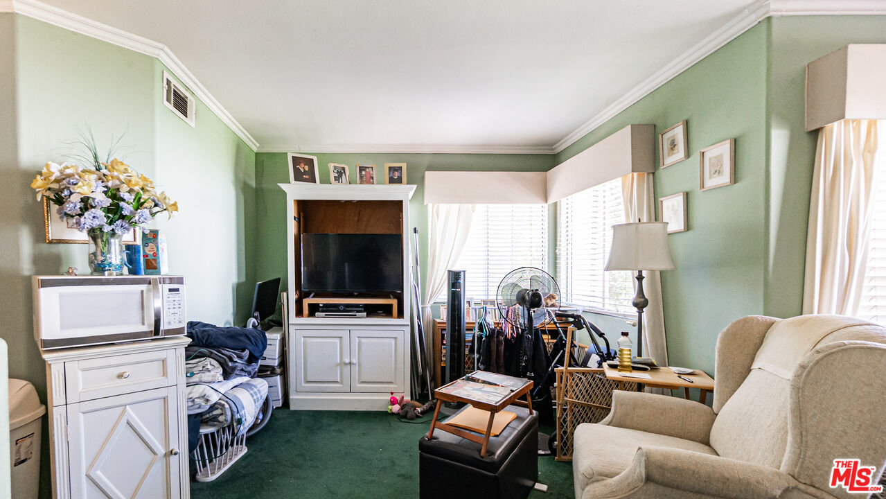25843 Browning Place Stevenson Ranch, CA 91381 - Photo 28 of 37 a living room with furniture and a flat screen tv