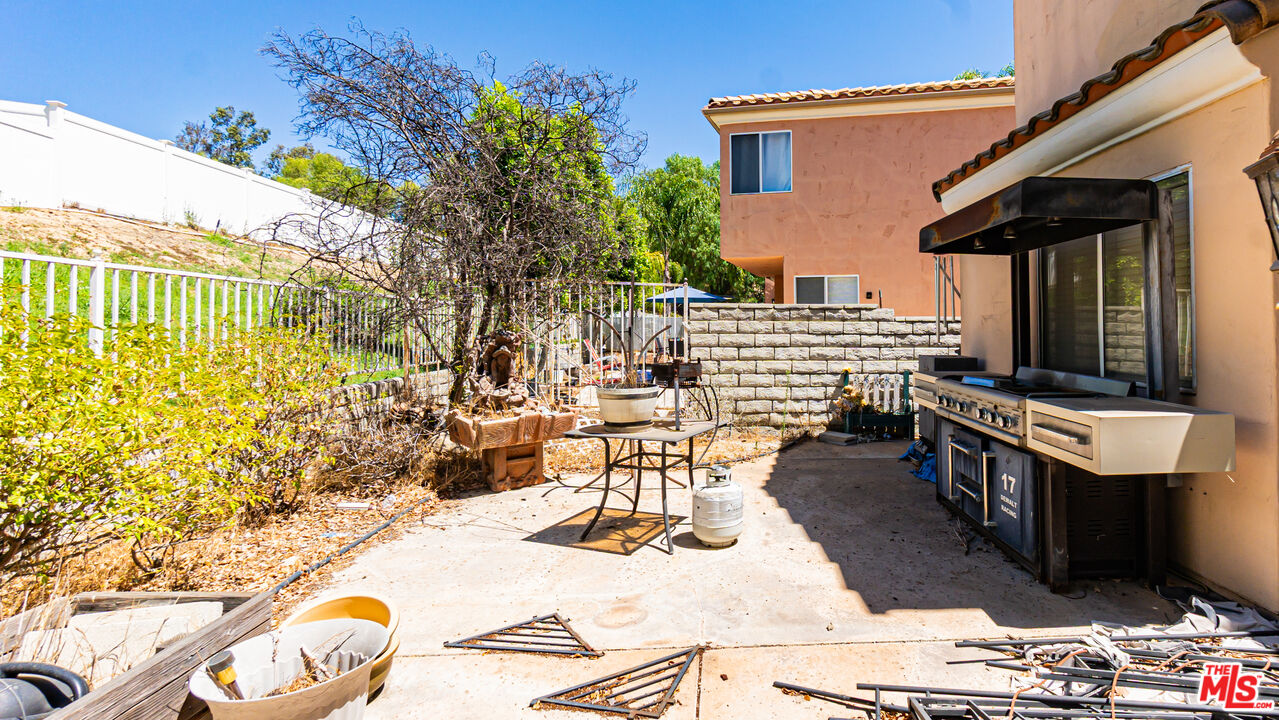 25843 Browning Place Stevenson Ranch, CA 91381 - Photo 35 of 37 a view of a patio with table and chairs