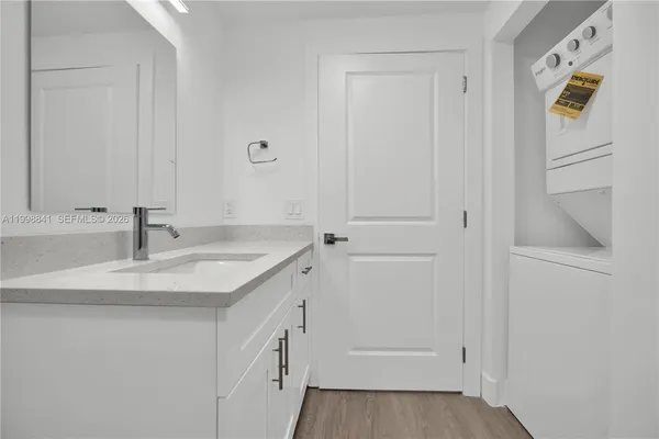 a bathroom with a sink and mirror