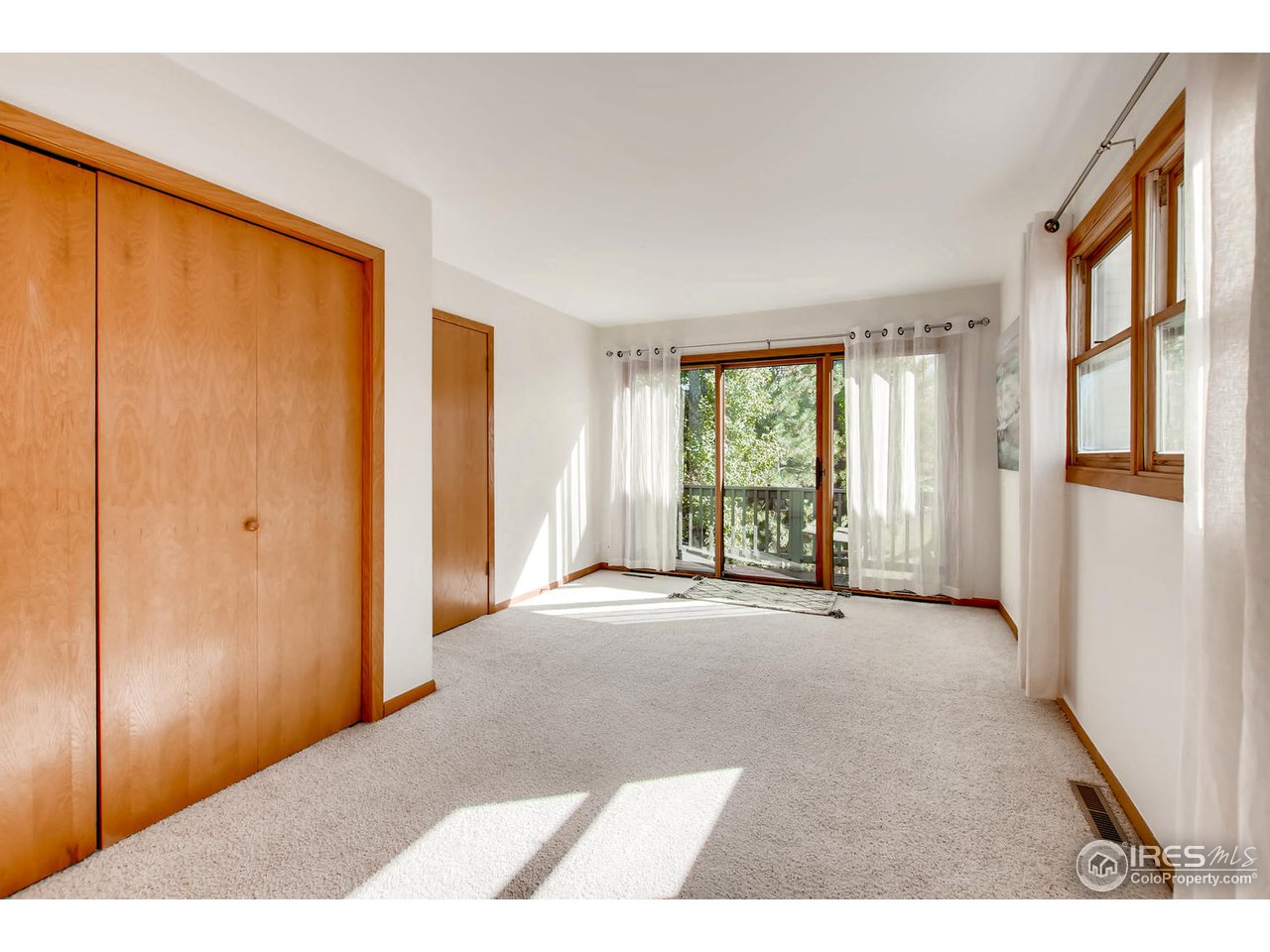 4110 Riverside Avenue Boulder, CO 80304 - Photo 21 of 39 a view of an empty room with a window