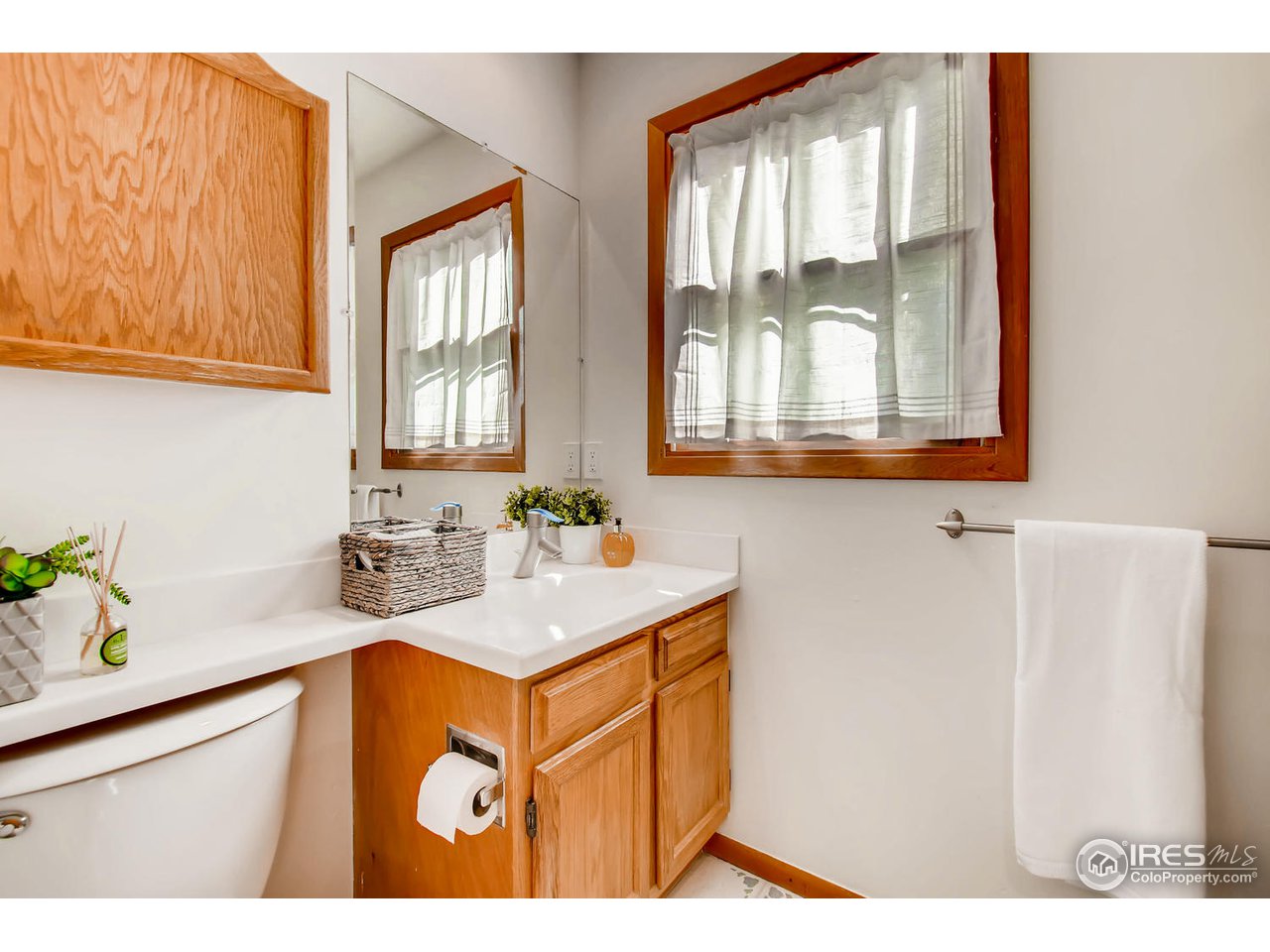 4110 Riverside Avenue Boulder, CO 80304 - Photo 22 of 39 a bathroom with a sink a vanity and a window