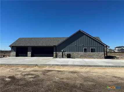 a house with trees in the background