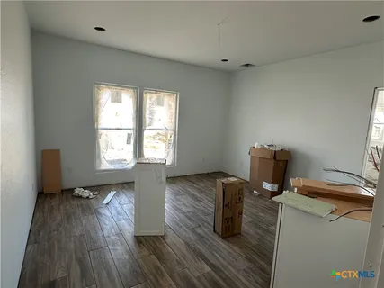 a view of a storage and utility room with washer and dryer