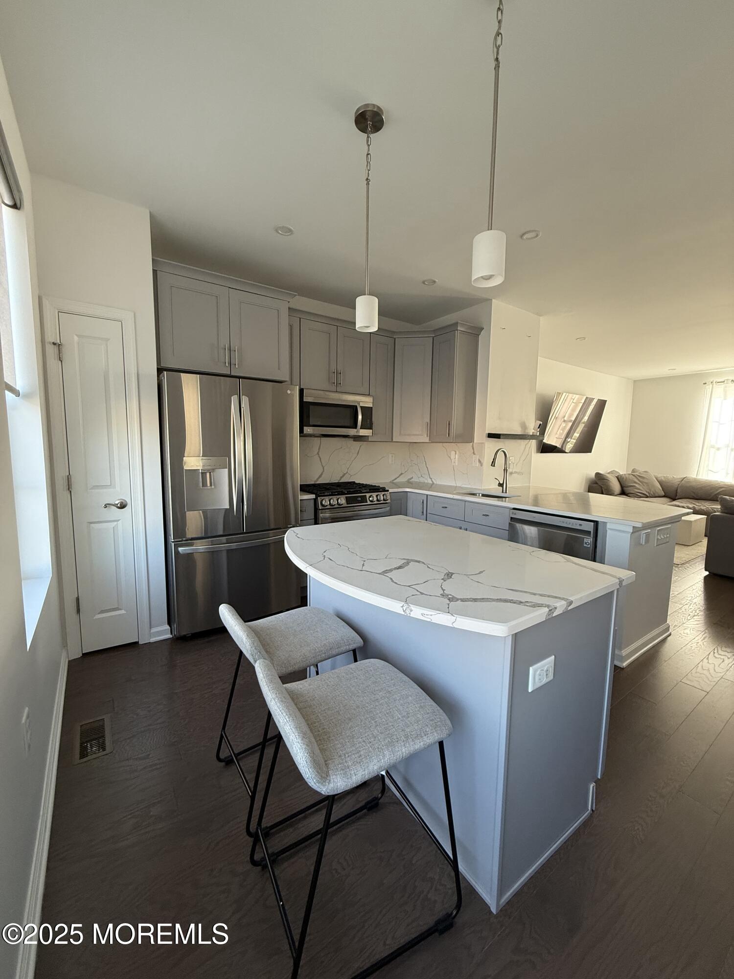 300 Prestige Road Brick, NJ 08723 - Photo 11 of 50 a kitchen with stainless steel appliances granite countertop a sink a stove a refrigerator and island