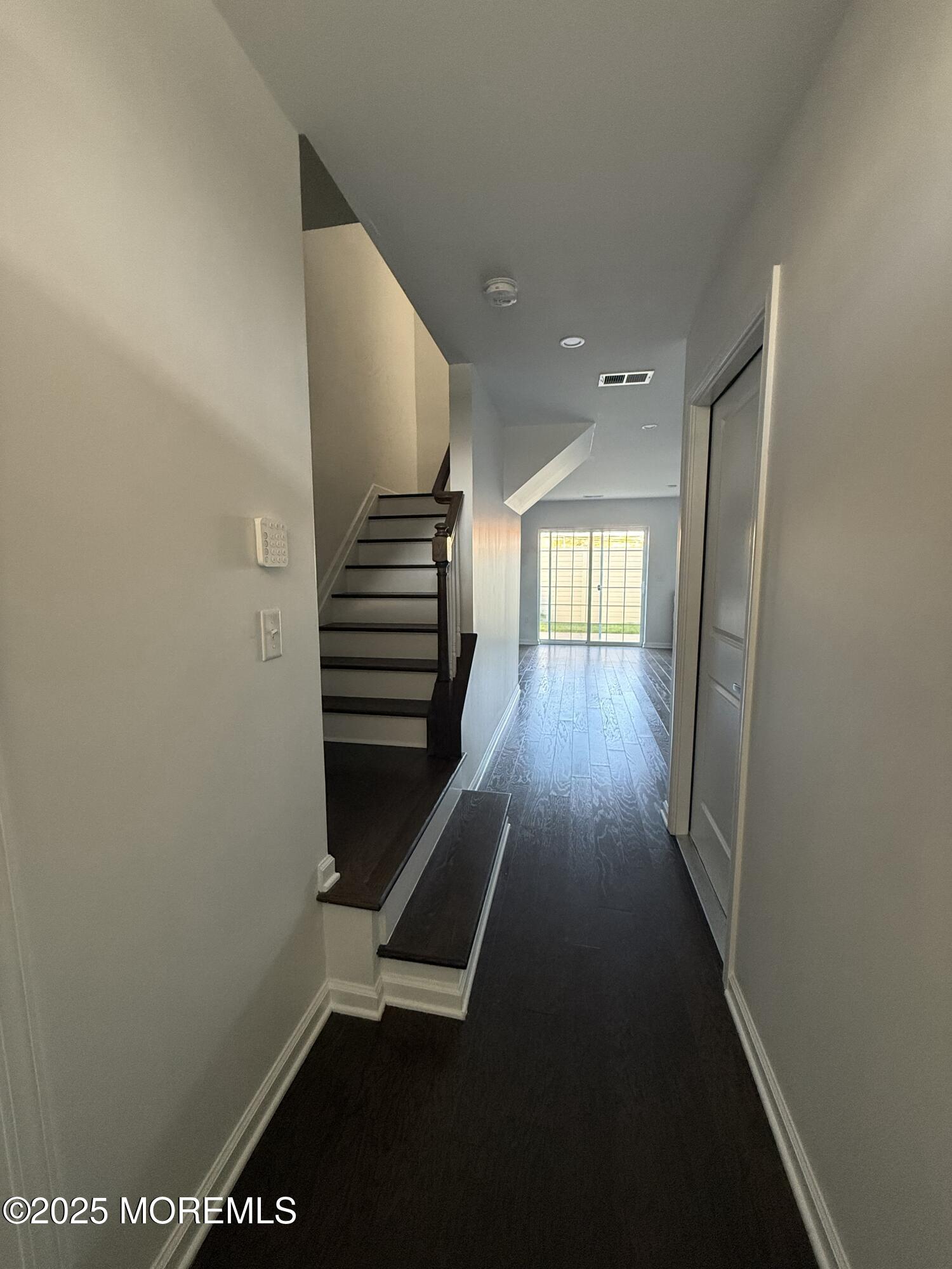 300 Prestige Road Brick, NJ 08723 - Photo 2 of 50 a hallway with wooden floor and windows