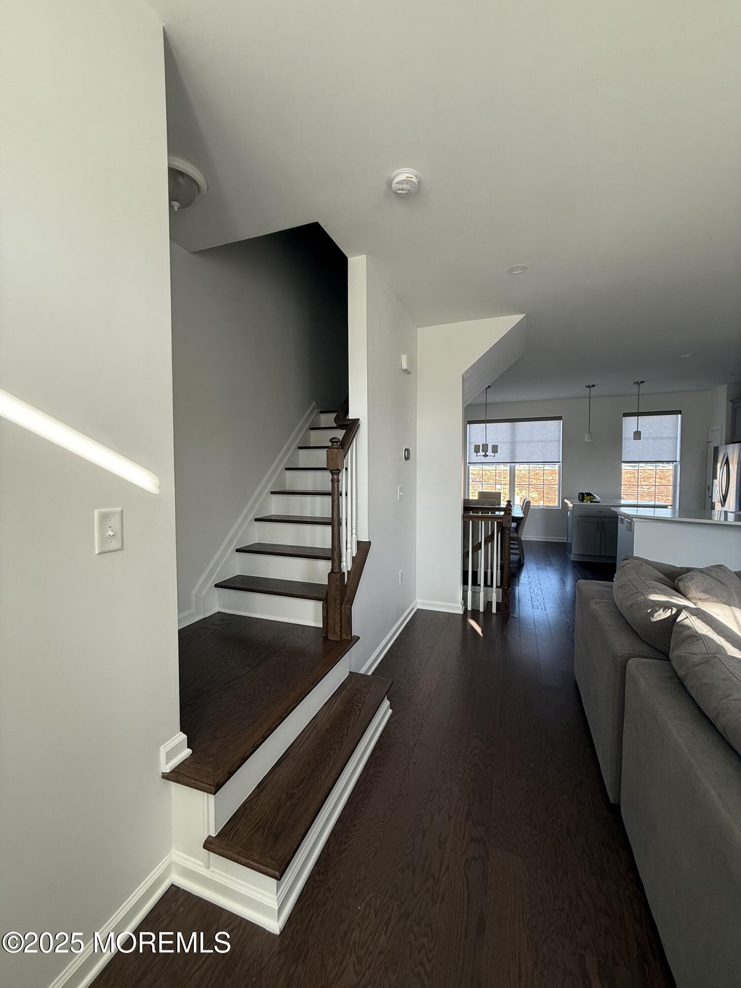 300 Prestige Road Brick, NJ 08723 - Photo 24 of 50 a living room with furniture and stairs