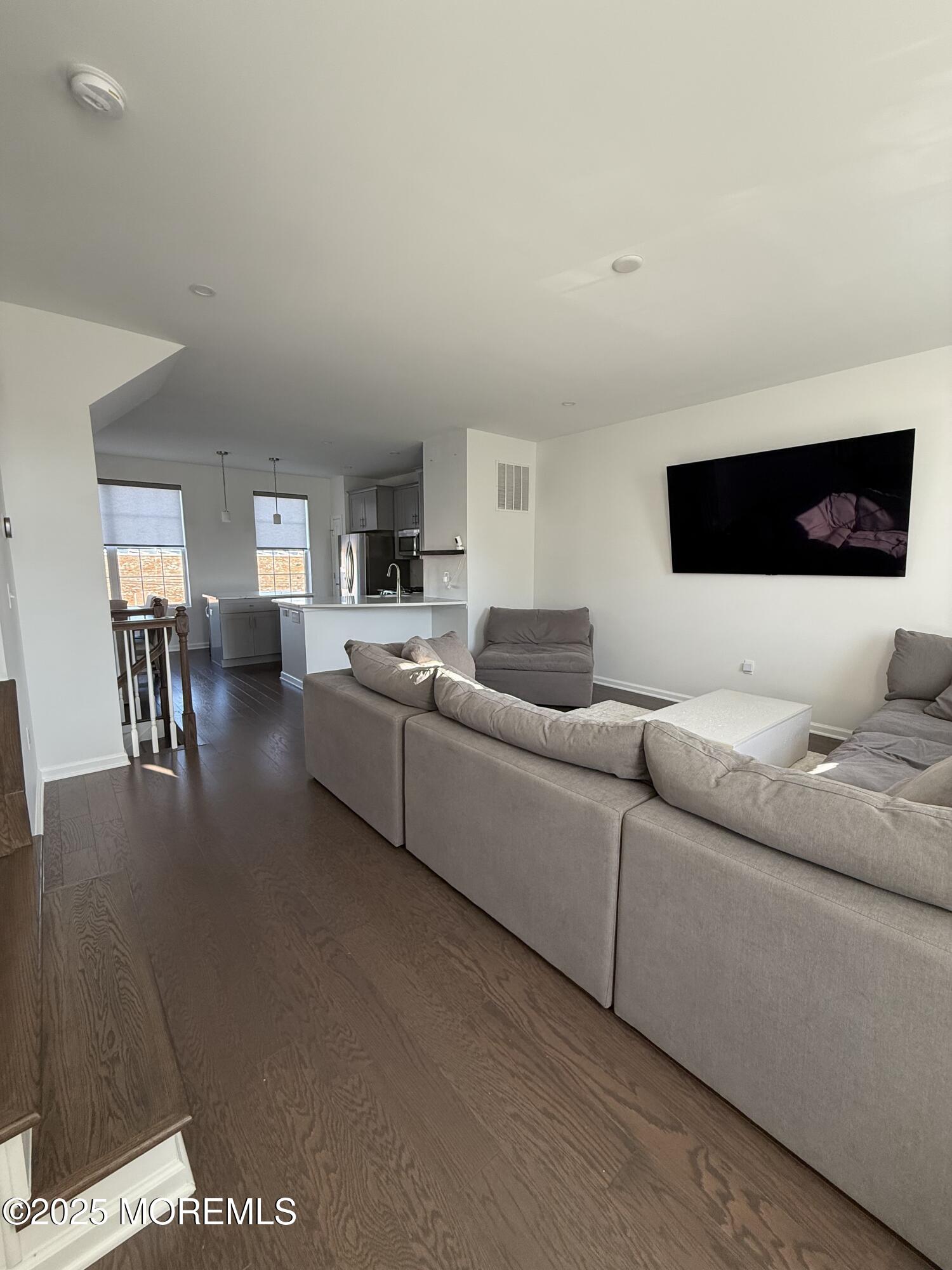 300 Prestige Road Brick, NJ 08723 - Photo 25 of 50 a living room with furniture and a flat screen tv