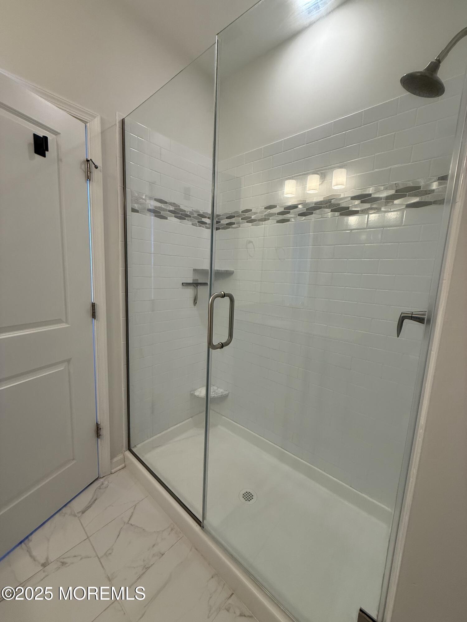 300 Prestige Road Brick, NJ 08723 - Photo 42 of 50 a bathroom with a glass shower door