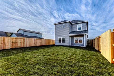 a view of a backyard with swimming pool