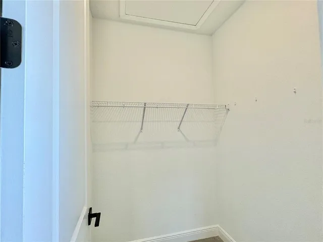 a view of small space with racks on the wall