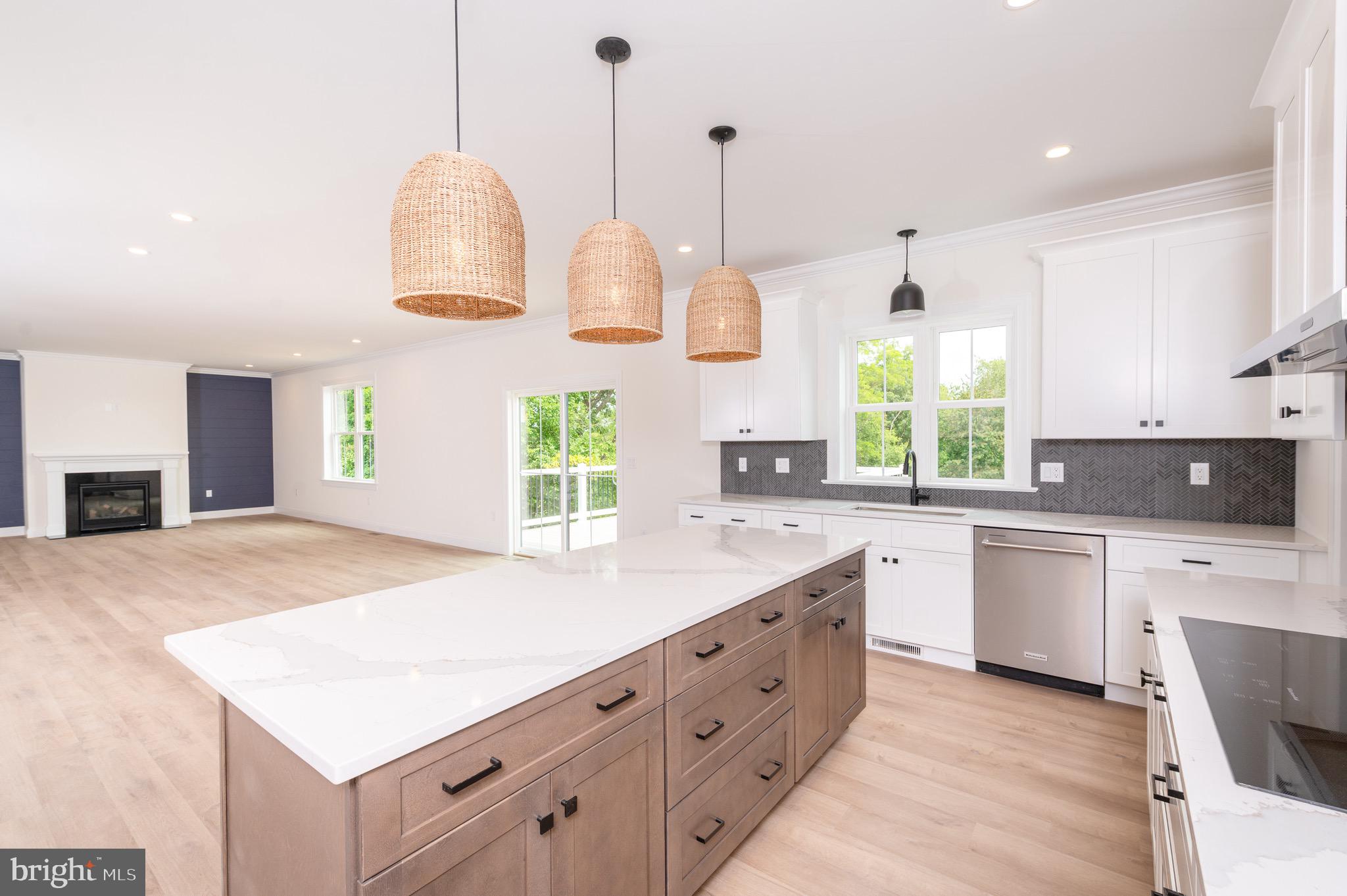2328 Rockvale Road Lancaster, PA 17602 - Photo 16 of 55 a kitchen with kitchen island granite countertop a sink a counter top space appliances and cabinets