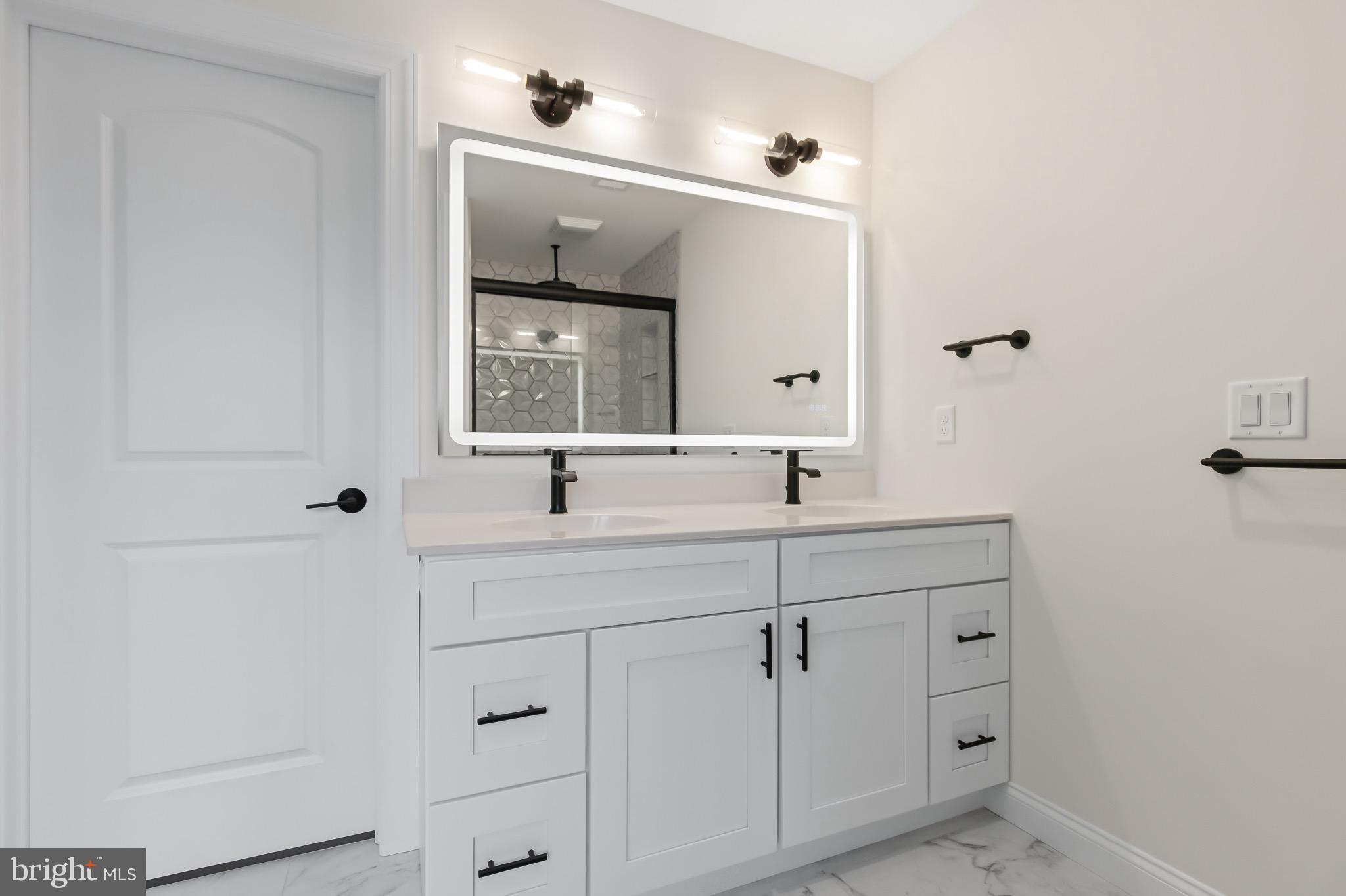 2328 Rockvale Road Lancaster, PA 17602 - Photo 34 of 55 a bathroom with a sink and a mirror