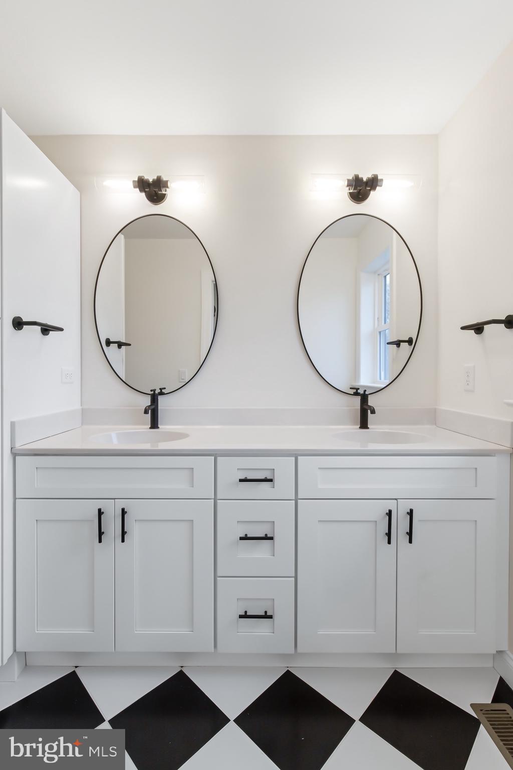 2328 Rockvale Road Lancaster, PA 17602 - Photo 39 of 55 a bathroom with a double vanity sink and a mirror