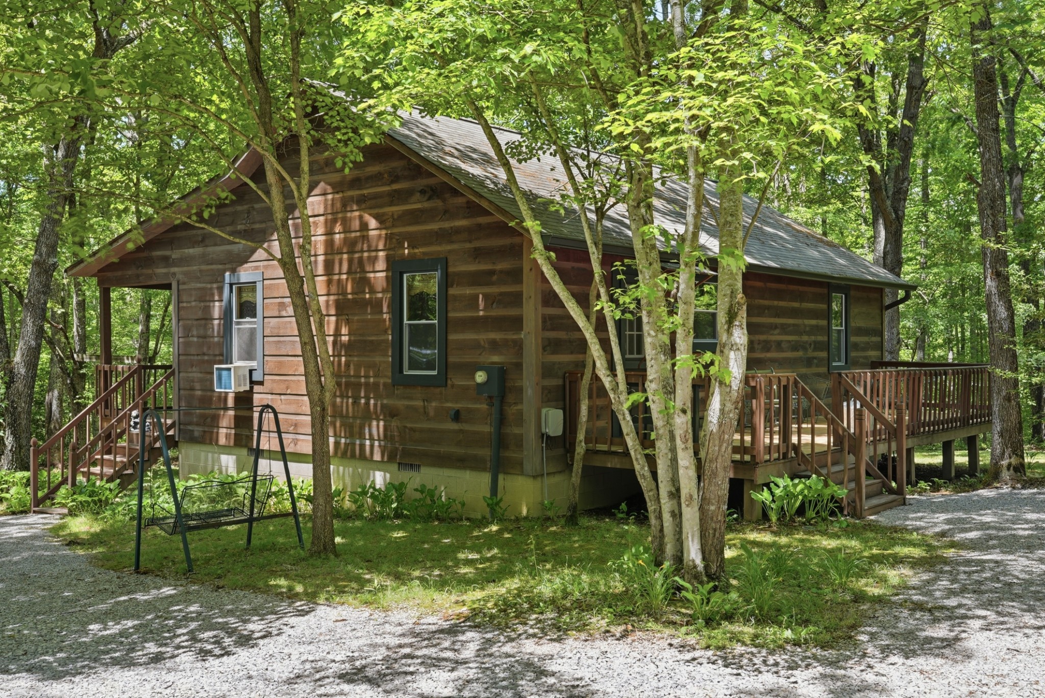 118 Cherokee Road Spencer, TN 38585 - Photo 2 of 85 a front view of a house with garden