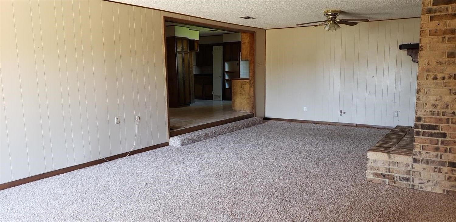 1007 2nd Street Plains, TX 79355 - Photo 3 of 11 an empty room with windows