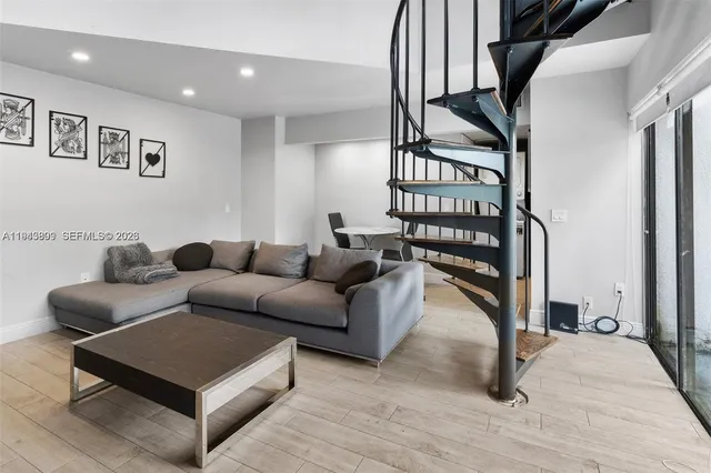 a living room with furniture and a rug