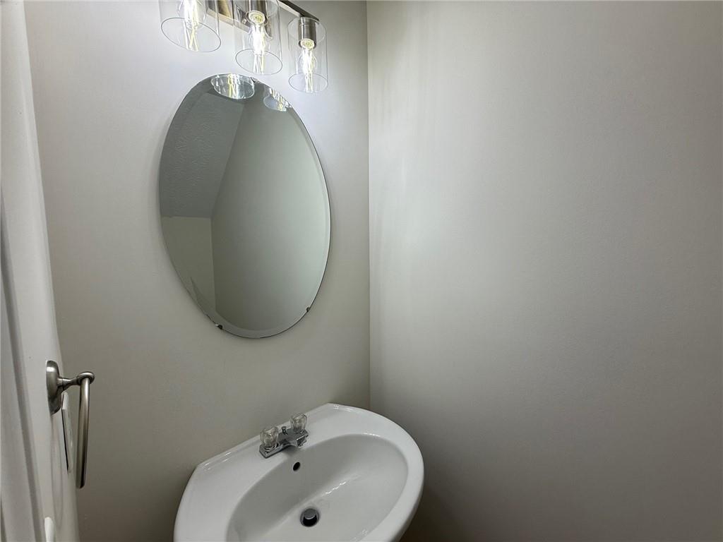 2966 Fairton Trail Lithonia, GA 30038 - Photo 13 of 28 a bathroom with a sink and mirror