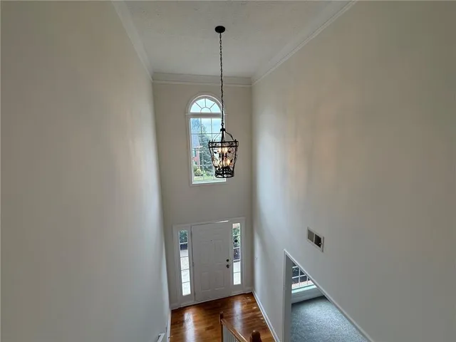 wooden floor and window in an empty room